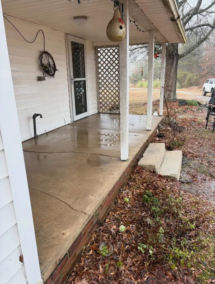 Clean concrete porch after pressure washing