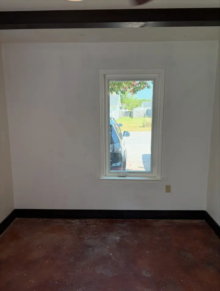 Smooth restored wall around a window